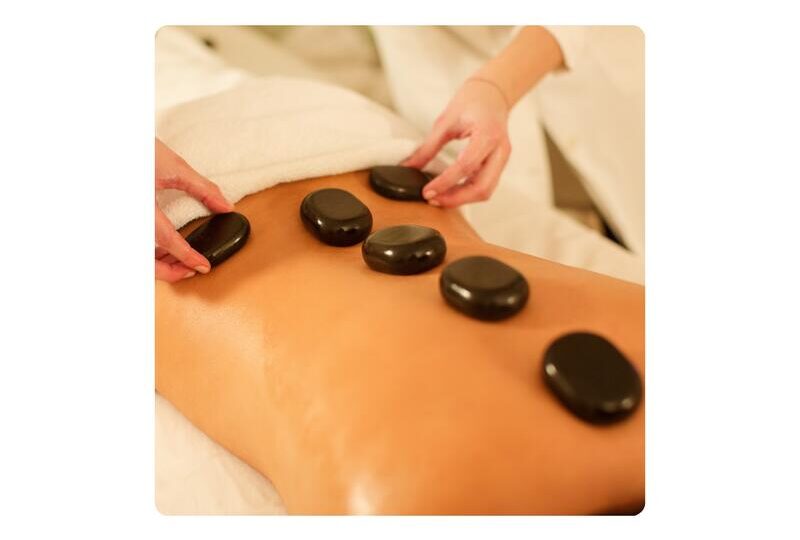 Hot Stone Back Neck and Shoulder Massage in Llandudno at HUSH