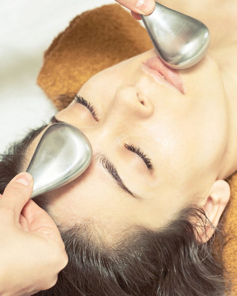 Thermal Indulgence treatment in Llandudno at HUSH Therapies combining hot stone back massage with a cooling ice globe facial