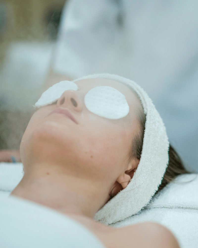 Woman enjoying a luxury facial treatment at HUSH Therapies in Llandudno”