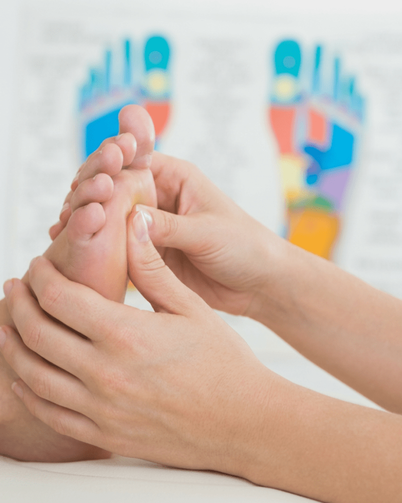 Person enjoying oncology reflexology treatment at HUSH Therapies in Llandudno